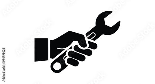 A hand firmly gripping a wrench a striking black silhouette