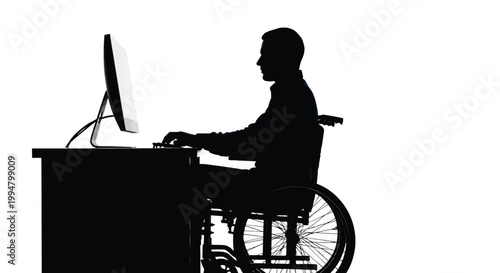 Person using a computer and wheelchair depicted in stark silhouette