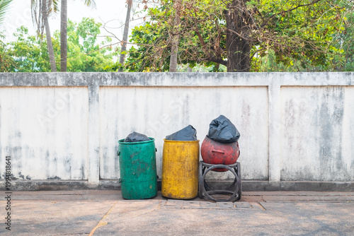 Plastic wheelie bin on sidewalk, recycling and waste management in residential area