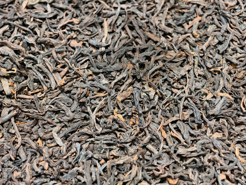 Full frame close-up of dried black tea leaves