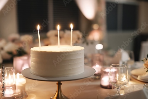 Celebration Featuring a White Cake With Candles on a Table in a Dining Area D...