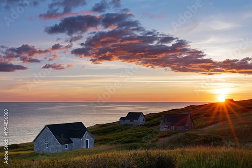 Sunset View Over Houses by the Sea in a Coastal Landscape During Evening Hours