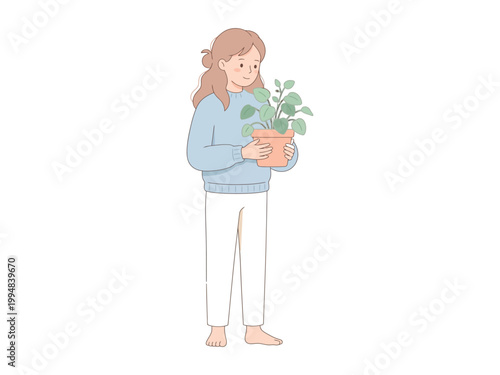 A young girl holding a potted plant in her hands standing barefoot looking down at the green leaves  plant care
