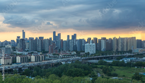 Vászonkép Nanjing skyline with elevated highway under storm clouds