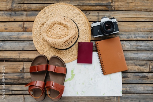 Travel Essentials Arranged on Wooden Surface for Adventure Preparation