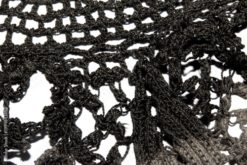 Close up of vintage black gothic lace fabric white on black background embroidery