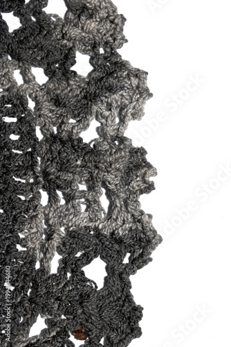 Close up of vintage black gothic lace fabric white on black background embroidery