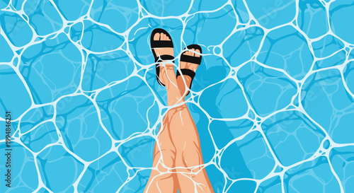 Top view of a person wearing black sandals with their legs crossed in crystal clear blue swimming pool water.