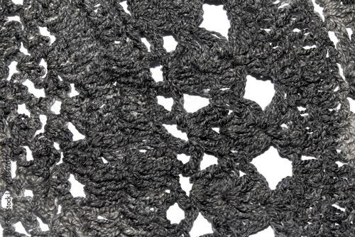 Close up of vintage black gothic lace fabric white on black background embroidery