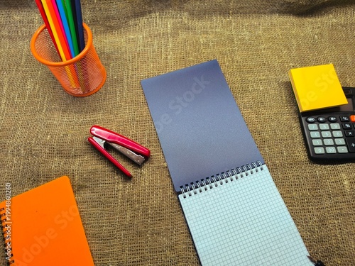 Stationery items laid out on a flat background. Education concept.