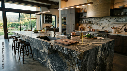 Luxury kitchen with dark marble island and gold accents