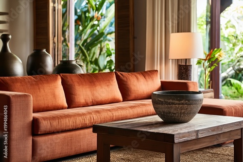 Cozy Living Room With Orange Sofa and Wooden Coffee Table in Tropical Setting