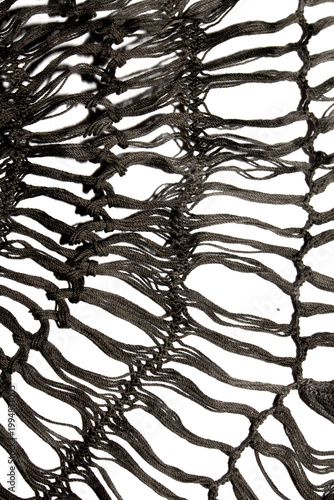 Close up of vintage black gothic lace fabric white on black background embroidery