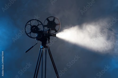 Old Film Projector Shines Light in Dark Space During a Movie Night Event