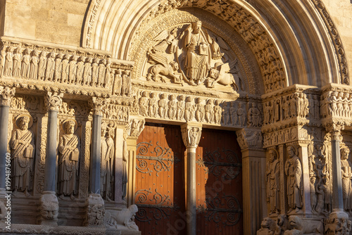 Arles church arch and gate in Romanesque architecture Church of St. Trophime (also called Cathédrale Saint-Trophime) in france
