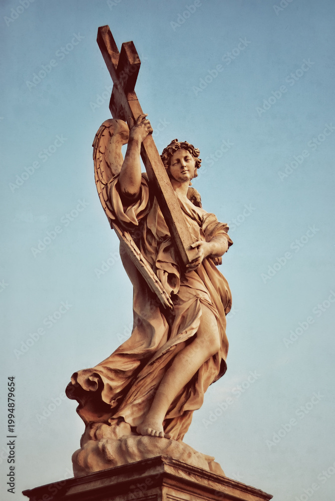Fototapeta premium Angel with a cross on the Ponte Sant'Angelo. Rome, Italy
