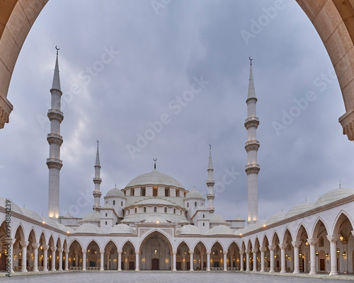 Courtyard of Sheikh Zayed Mosque in Fujairah, UAE Framed by Arch