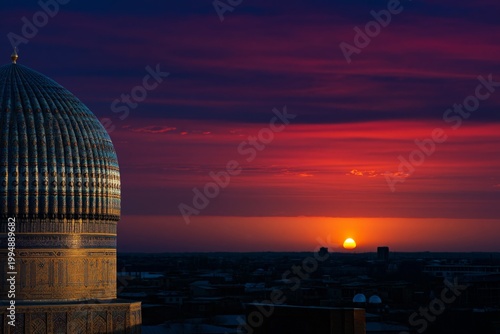 Sunset Over the Dome of a Historic Building in a City With Colorful Clouds in...