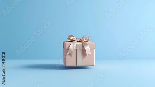 Beautifully wrapped gift box with shiny rose gold paper and bow
