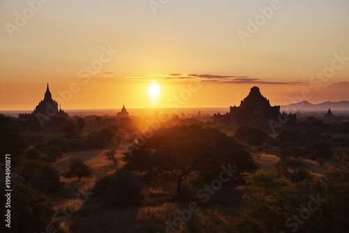 Sunrise Over Ancient Temples in Bagan, Myanmar Creates Warm Glow and Soft Sha...
