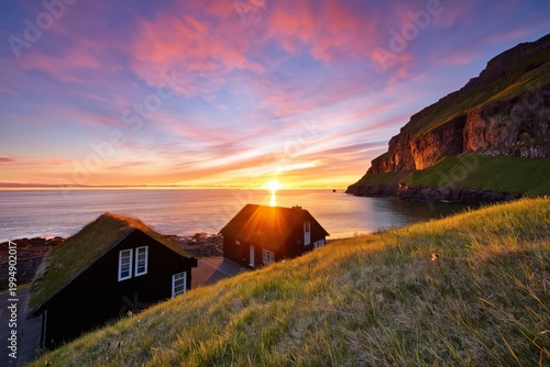 Sunset Over Coastline With Thatched Roof Houses by the Sea in the Faroe Islands