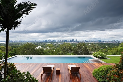 Scenic View From a Modern Pool Area Overlooking a City Skyline on a Cloudy Day