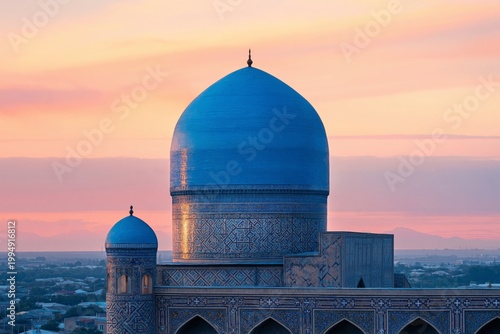 Blue Dome of Mosque Shines Under Sunset Sky in Cityscape View of Samarkand