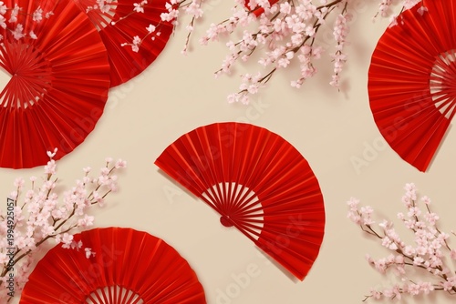 Red Fans and Cherry Blossoms Create a Simple Decoration Arrangement on a Ligh...