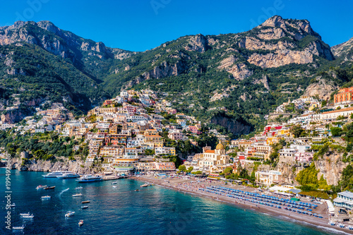 Photography Aerial view of Positano with comfortable beach and blue sea on Amalfi Coast in Campania, Italy