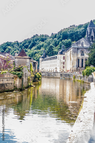 Perspective view along the Dronne river with the Benedictine Abbey dominating the right bank