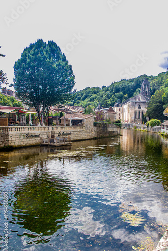 Perspective view along the Dronne river with the Benedictine Abbey dominating the right bank