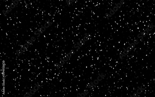 Falling snow flakes on black.
