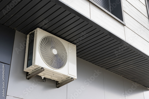 Modern air conditioning unit mounted on a contemporary building facade