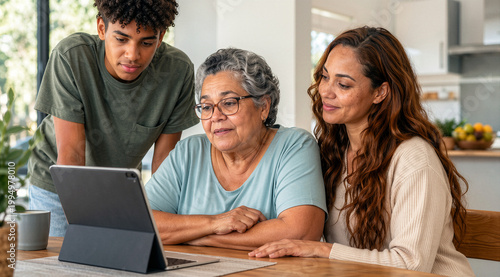 Multi generational Family Using Tablet Together at Home