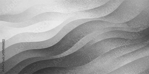 Abstract wavy black and white silk fabric texture features a soft macro curve pattern resembling light grey satin ripples or wind-blown winter snow