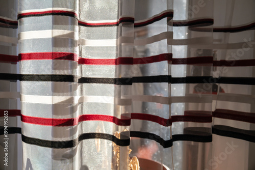 Colored horizontal stripes on white curtains. Curtain pattern.