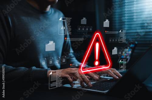 Data security warning and cyber risk alert concept. Person using laptop with digital files, lock icon, red warning symbol. data breach, document protection, threat detection, secure incident response