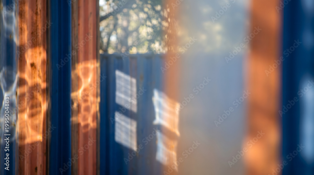 Naklejka premium Golden Sunlight Through Blurred Window