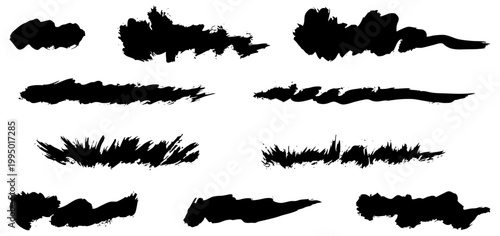 Expressive black ink swatches created with small flat bristle brush. Manual handdrawn paint blots and textured smudges. Unique analog artistic shapes on paper