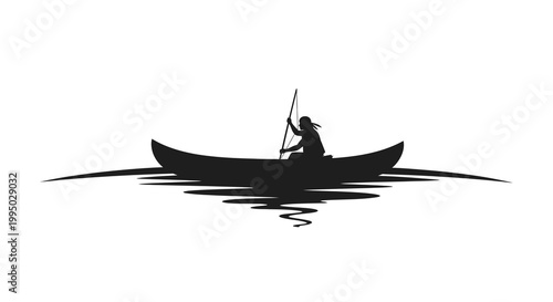 Silhouette of a person canoeing on calm water with rippling reflections