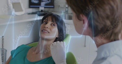Lying patient teal-top on green-dental-chair, clinician light-coat latex-gloved examining, xray-ECG