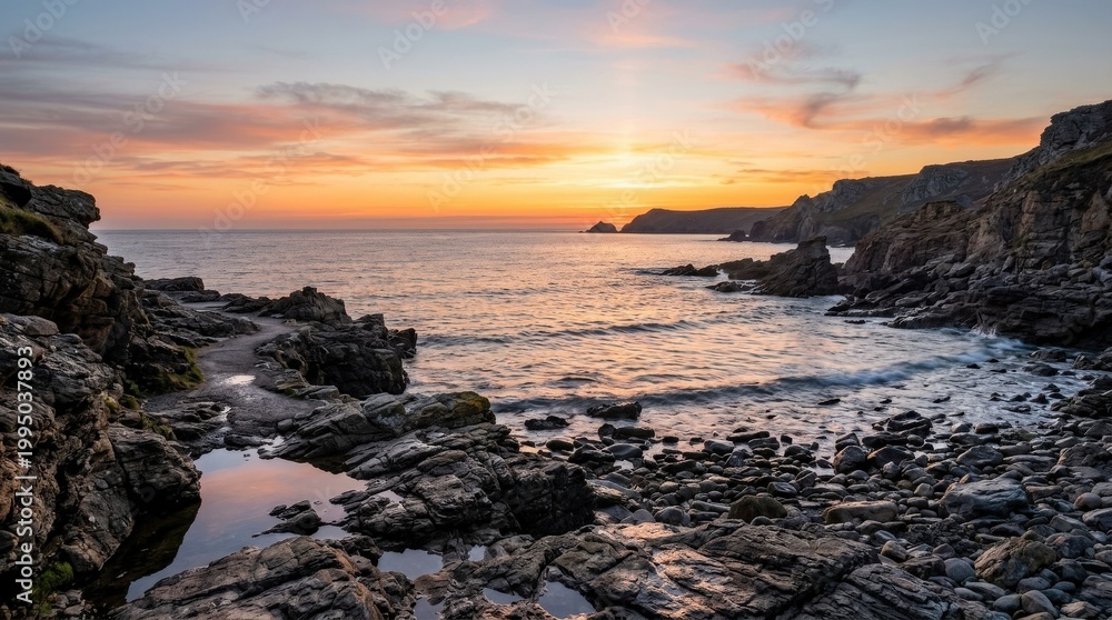Obraz premium Calm rocky coastline at sunset with gentle waves, peaceful seascape for travel, reflection and nature concepts, warm horizon glow, balanced composition, soft light, crisp focus, premium scenic detail,
