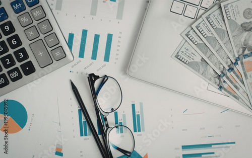 Business finance workspace with calculator glasses money and financial charts on desk for accounting and budgeting