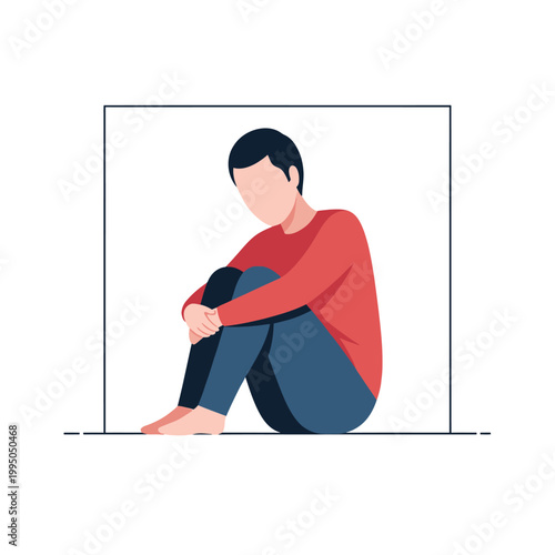 Sad young man sitting alone.