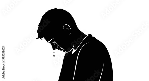 Silhouette of a man with his head bowed appearing to cry