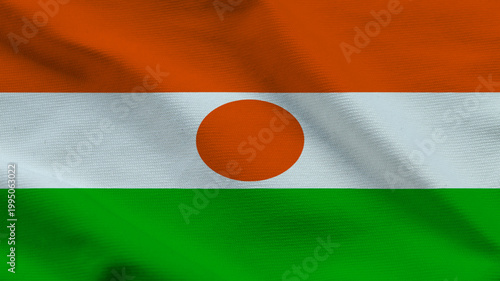 The flag of Niger flutters in the wind, displaying orange, white, and green colors. The central circle symbolizes unity as it flies proudly Free Download The flag of Niger flutters in the wind, displaying orange, white, and green colors. The central circle symbolizes unity as it flies proudly - GFXLoad
