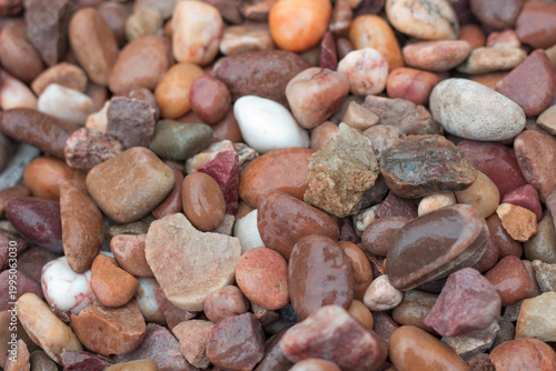 Pebble stone texture close up beach surface background 