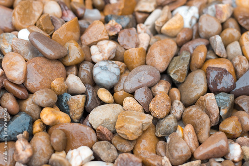 Pebble stone texture close up beach surface background 
