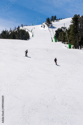 The Pal resort in Andorra is the most family-friendly and accessible sector of the Pal Arinsal ski area.  La Massana,  Skiers coming down the slope.