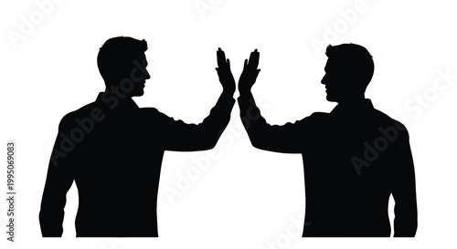 Quadro em tela Two men giving each other a high five in a silhouette